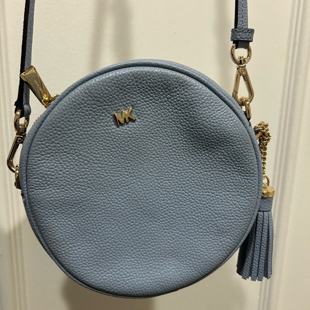Michael Kors Delancey light blue round crossbody purse. With tassel.